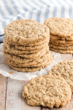 a stack of oatmeal cookies sitting on top of a wooden table