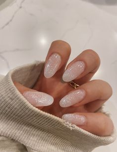 White Glitter Nails With Snowflakes, Simple New Years Nails Almond, White Nails With Glitter Almond Shape, Winter Nails Glitter White, Minimal Nye Nails, Clean Glitter Nails, Sparky White Nails, Nye Almond Nails, Minimal New Years Nails