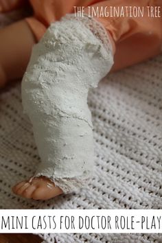 a doll is laying down on a crocheted blanket with the words mini casts for doctor role - playing