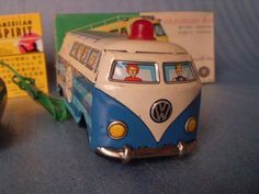 a toy vw bus is next to a game controller