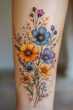 a woman's thigh with flowers painted on the side and in front of her