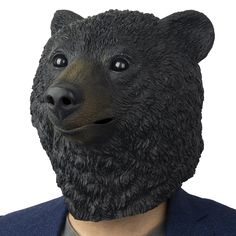 a man wearing a bear mask on his face