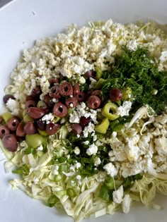 a white bowl filled with lots of different types of food