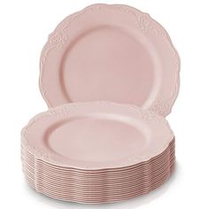 pink plates stacked on top of each other with white lace trimming around the edges