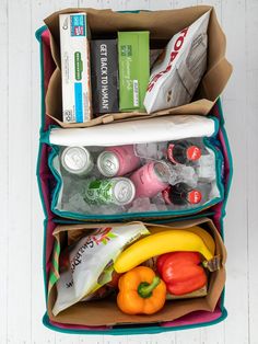 two bags filled with food and drinks on top of a white wooden floor next to each other