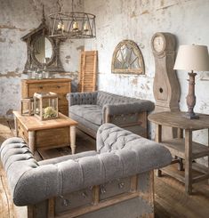 a living room filled with lots of furniture next to a wooden table and clock on the wall