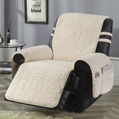 the reclining chair is covered in sheepskin and has black trimming on it