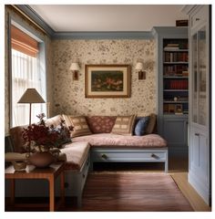 a living room filled with furniture and bookshelves next to a painting on the wall