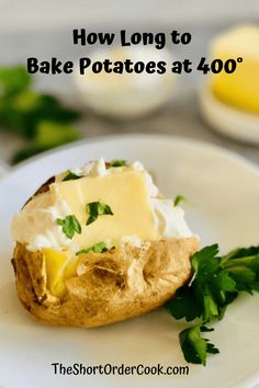 baked potato with butter and parsley on white plate