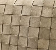 a close up view of the back of a couch cushion made out of leather material