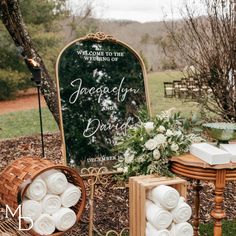 an outdoor wedding ceremony set up with white flowers