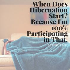 a woman laying on top of a couch under a blue blanket with the words when does hibernation start because i'm 100 % participating in that