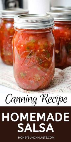 three jars filled with homemade salsa sitting on top of a table