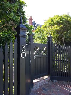 a black gate with the number thirty on it