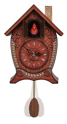 a wooden cuckoo clock with a pine cone on the top and an image of a bird