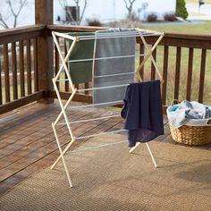 an ironing board and clothes on a deck