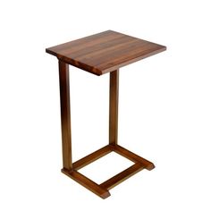 a small wooden table sitting on top of a white floor