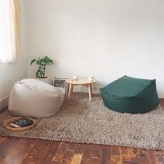 a living room with a bean bag chair and coffee table