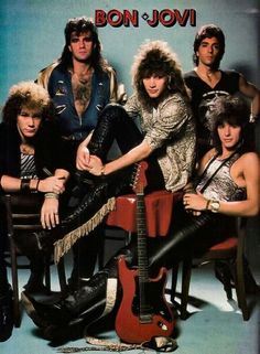 the band bon jovi posing with their guitars