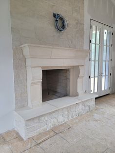 an empty fireplace in the middle of a room