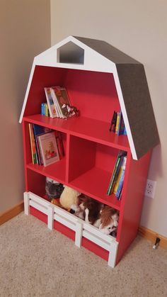 a red and white book shelf with books on it