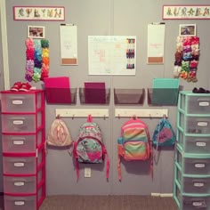 a room with several bins and bags on the wall