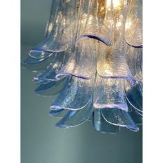 a glass chandelier hanging from the ceiling