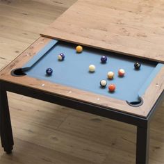 a pool table with several balls on it