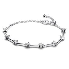 From Pandora, opt for a modern classic with the Sparkling Bars Bracelet. Featuring triangular prism bars punctuated by eight sparkling stones in open basket settings, this sterling silver bracelet balances sleek lines with round curves. The bars are cleverly connected by jump rings, allowing for flexibility and sparkling movement. The adjustable clasp features a dangling chain with one sparkling stone at the end. Designed for creative stacking with other pieces, this classic bar bracelet has end Triangular Prism, Classic Bar, Wedding Day Jewelry, Bar Bracelet, Pandora Style, Bar Bracelets, Pandora Bracelets, Sterling Silver Bracelet, Pandora Jewelry