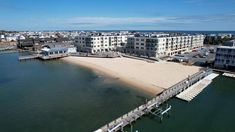 an aerial view of the beach and pier