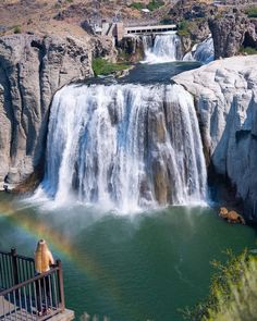 there is a rainbow in the water at this waterfall and it looks like something out of a fairy tale