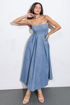 An artfully washed midi dress in soft denim, boasting a sleek straight neckline and delicate shoulder straps finished with inverted pleats. The exquisite back tie closure adds a touch of elegance to this effortlessly chic piece.Details:Self : 90% Cotton 10% PolyesterSize & Fit- Model is 5`7" And Wearing Size Small- Measurements Taken From Size Small- Approx. Length: 51" Denim Photoshoot, Tufting Ideas, Outdoor Kitchen Decor, Flirty Tops, B Tech, Denim Maxi Dress, Denim Midi Dress, Easy Dress, Jean Dress