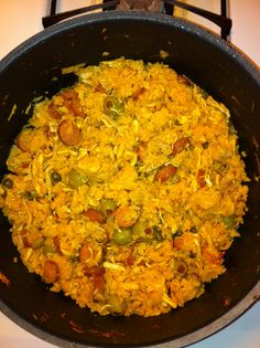 a pan filled with food sitting on top of a stove