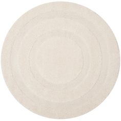 a white rug with circles in the middle on a white background, it is very soft and clean