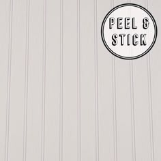 a sticker that says peel and stick on the side of a building with white siding