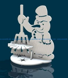 a snowman holding a broom on top of a table