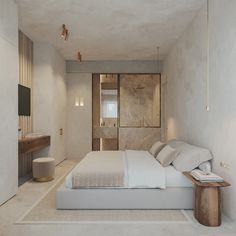 a bedroom with a large bed and white walls