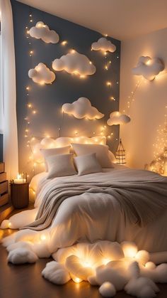 a bedroom decorated in white with clouds and lights