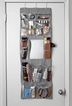 an over the door hanging organizer with various items on it's sides and doors