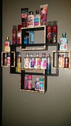 a wall mounted shelf filled with lots of different types of soaps and lotions