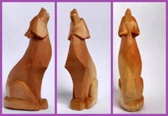 three wooden sculptures of dogs sitting side by side on a white background with purple border