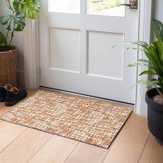 a pair of shoes sitting on the floor next to a door