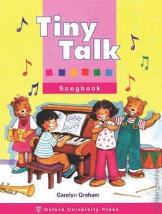 the tiny talk songbook features three children playing instruments and singing with music notes on them