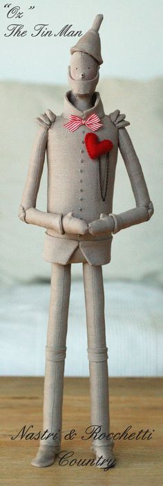 an image of a paper man with a heart on his chest and hands in his pockets