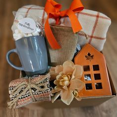 a gift basket filled with coffee, marshmallows, and other holiday items