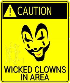 a yellow and black sign with the words caution written below it that says,'kicked clowns in area '