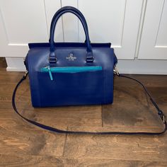 Like New! Kate Spade Purse. Cobalt Blue And Turquoise With Gold Hardware. Front Pocket And Front Zipper Section As Well. Perfect For Phone, Keys And Other Items That You Need Frequent Access Too. Spacious And Clean Interior. Small Zipper Compartment Inside And 2 Pockets. Removeable Crossbody Strap Included As Well. Perfect Spring/Summer Bag. Will Add A Pop Of Color To Any Outfit! Paid $425 From Kate Spade. Approximately 12.5 Inches Wide And 9 Inches Tall. Blue Top Handle Shoulder Bag For Errands, Blue Rectangular Satchel For On-the-go, Blue Top Handle Shoulder Bag For On-the-go, Blue Bags With Top Carry Handle For On-the-go, Turquoise Travel Bag With Detachable Strap, On-the-go Blue Rectangular Satchel, Blue Rectangular Office Bag, Rectangular Blue Office Bag, Blue Satchel With Top Carry Handle For Shopping