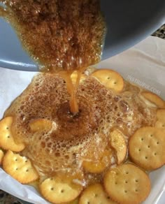 some crackers are being poured into a pancake