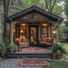 a couple of couches sitting inside of a small house