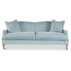 Designed with a kiln-dried hardwood frame, subtly rolled arms, and brass casters on its two tapered front legs, this cotton-blend velvet sofa makes an elegant addition to your space. A feather-and-down fill ensures long-lasting comfort and support. Handcrafted in the USA. Light Blue Sofa Living Room, Light Blue Couches, Blue Velvet Sofa Living Room, Sea Side Cottage, Light Blue Sofa, Blue Velvet Couch, Blue Sofas Living Room, Velvet Sofa Living Room, Blue Velvet Sofa